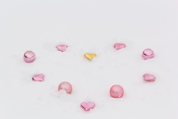  Decorative hearts and balls in the white snow