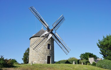 Fototapeta na wymiar A traditional windmill in Lancieux, Brittany (France) 