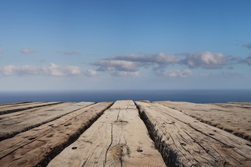vacation background - wooden board floor with ocean horizon 