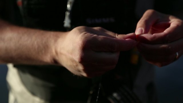 Fisherman Tying a Fly