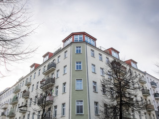 Obraz premium Modern Low Rise Apartment Building with Cloudy Sky