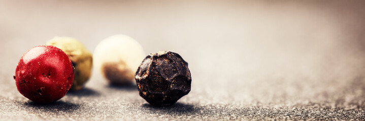 Macro shot with colorful pepper grains. Cooking concept