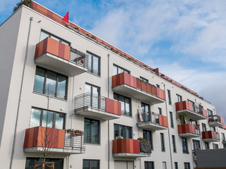 Fototapeta na wymiar Modern Apartment Building with Colorful Balconies