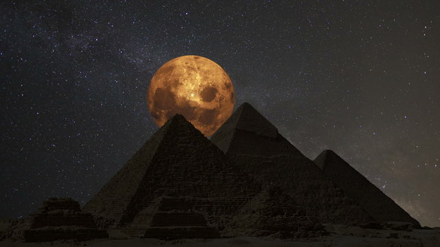 Supermoon over the great pyramids, Cairo, Egypt.  (Time lapse. Animation. Montage)