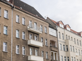 Old and New Apartment Buildings on Cloudy Day