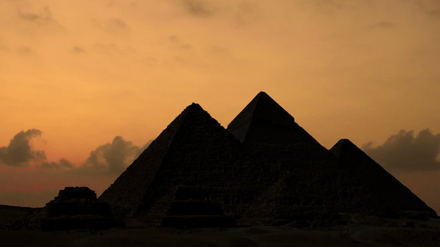 Sunrise over pyramids in Giza Egypt. (Time lapse. Animation. Montage)