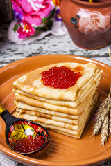 Pancakes with salmon caviar