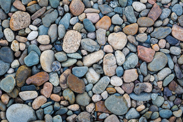 River bottom pebble stones texture background surface pattern
