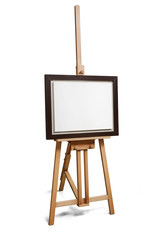 White painter canvas in frame on wooden easel with clipping path