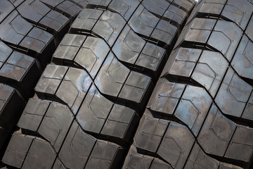 Stack of car tires close up wheel profile structure background