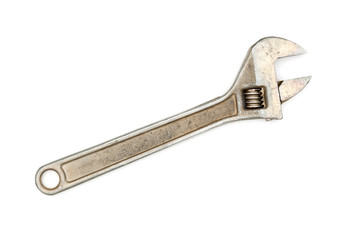 Old adjustable wrench on white background