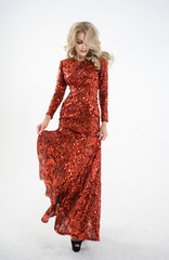 A girl in a long, red holiday dress