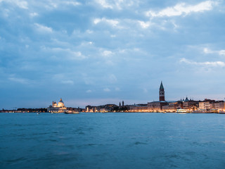 A view over the beautiful and romantic city skyline of Venice in Italy at dusk.
