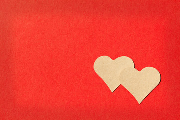 Two sepia heats on red background