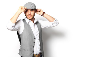 Happy young man. Portrait of handsome young man in casual shirt  smiling while standing against white background
