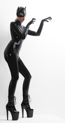 standing woman wearing latex clothes