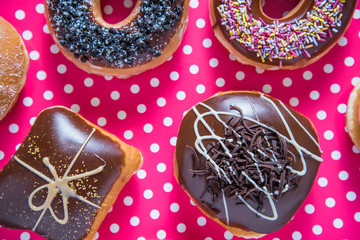 Artisan donuts on dotka pink background