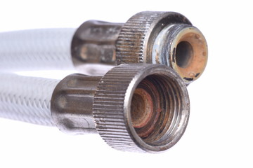 Old plumbing hose pipes isolated on white background