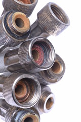 Old plumbing hose pipes isolated on white background