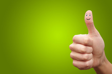 Happy cheerful smiley finger on green background