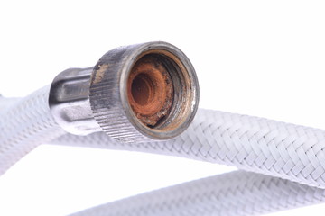 Old flexible metal hose pipe isolated on with white background