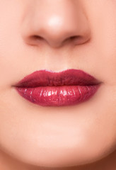 Close up portrait of beautiful young woman face, red lips