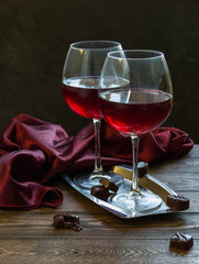 Red wine glasses and chocolates 