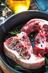 Raw lamb chops with fresh rosemary herb