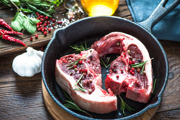 Raw lamb chops with fresh rosemary herb