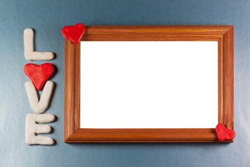 Wooden frame / Congratulations Valentines day on a blue background, to insert a photo or inscriptions.