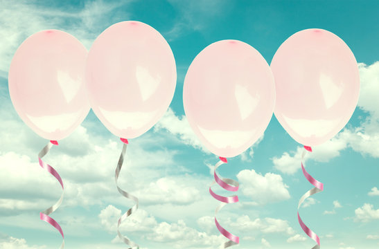 pink baloons in the sky