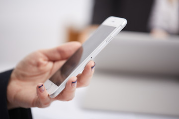 mobile phone in the women's hands
