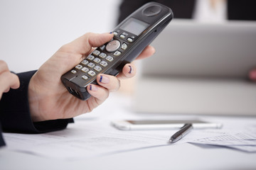 Radio phone in female hands