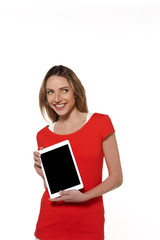 Young modern woman presenting a tablet  - isolated on white