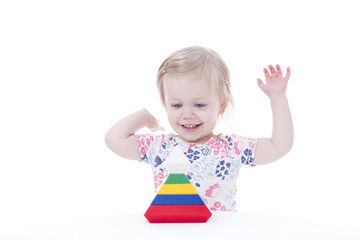 toddler girl stacking blocks