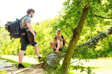 Naklejka na ściany i meble Hiking young couple with backpack outdoor
