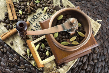 Old coffee grinder and spiced coffee