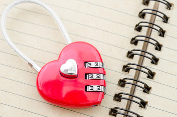 Red master key heart shape lock.