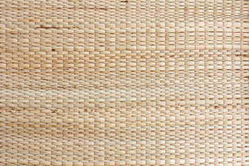 Surface mat woven into beautiful patterns background. Mat,reed texture natural materials.