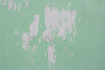 Old dirty cement texture : cracked concrete wall background : rough concrete background : Green peeling paint concrete wall.