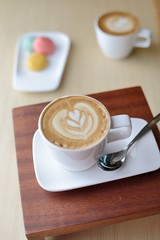 Coffee and pastries on old wooden table