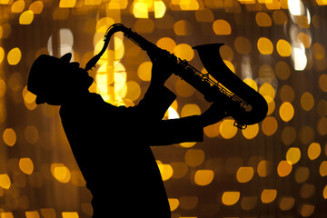 Saxophonist. Man playing on saxophone