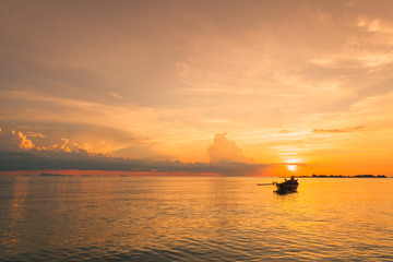 Fishing boat  with sunset scene in koh phangan, Surat Thani, Tha