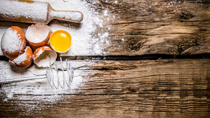 Preparation of the dough. Ingredients for the dough eggs with flour, whisk and rolling pin.