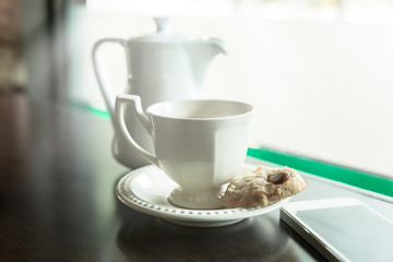 cup of tea with almond cookies