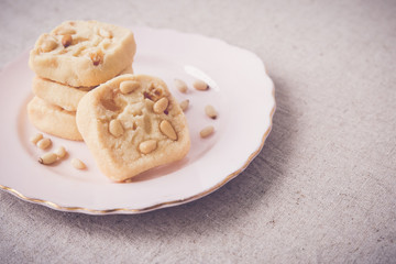 Homemade ginger and pine nut cookies, selective focus, toning