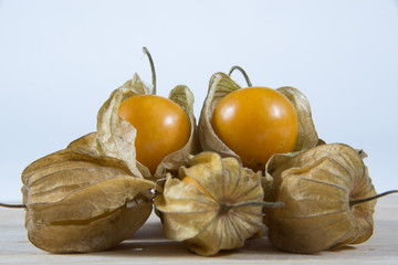 Cape gooseberry (Physalis) on wooden table, healthy fruit and vegetable