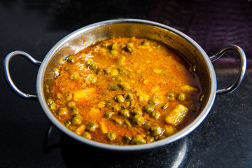 indian dish green gram with toamto curry and potatoes
