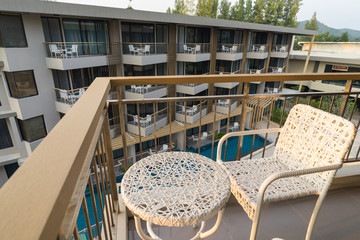 Relaxing while sunset at the balcony chair