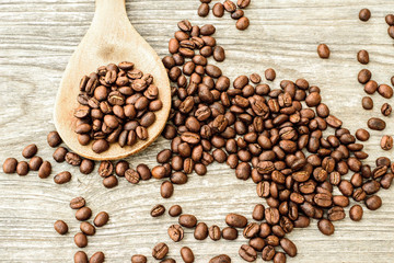 Coffee and spoon on wood table.